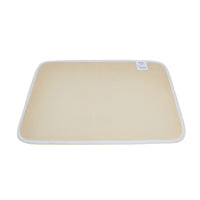 Beige woven floor mat with white trim and small label