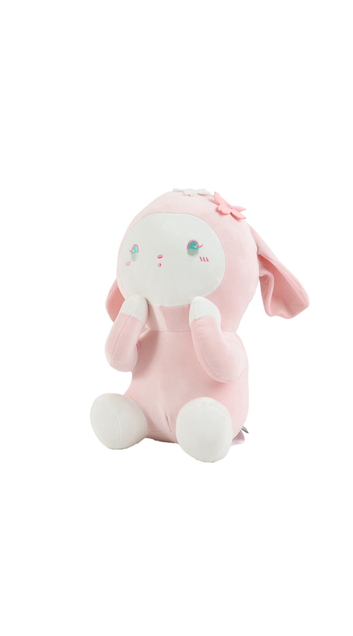 Pink plush rabbit sitting, flower bow on head, long ears and round feet.