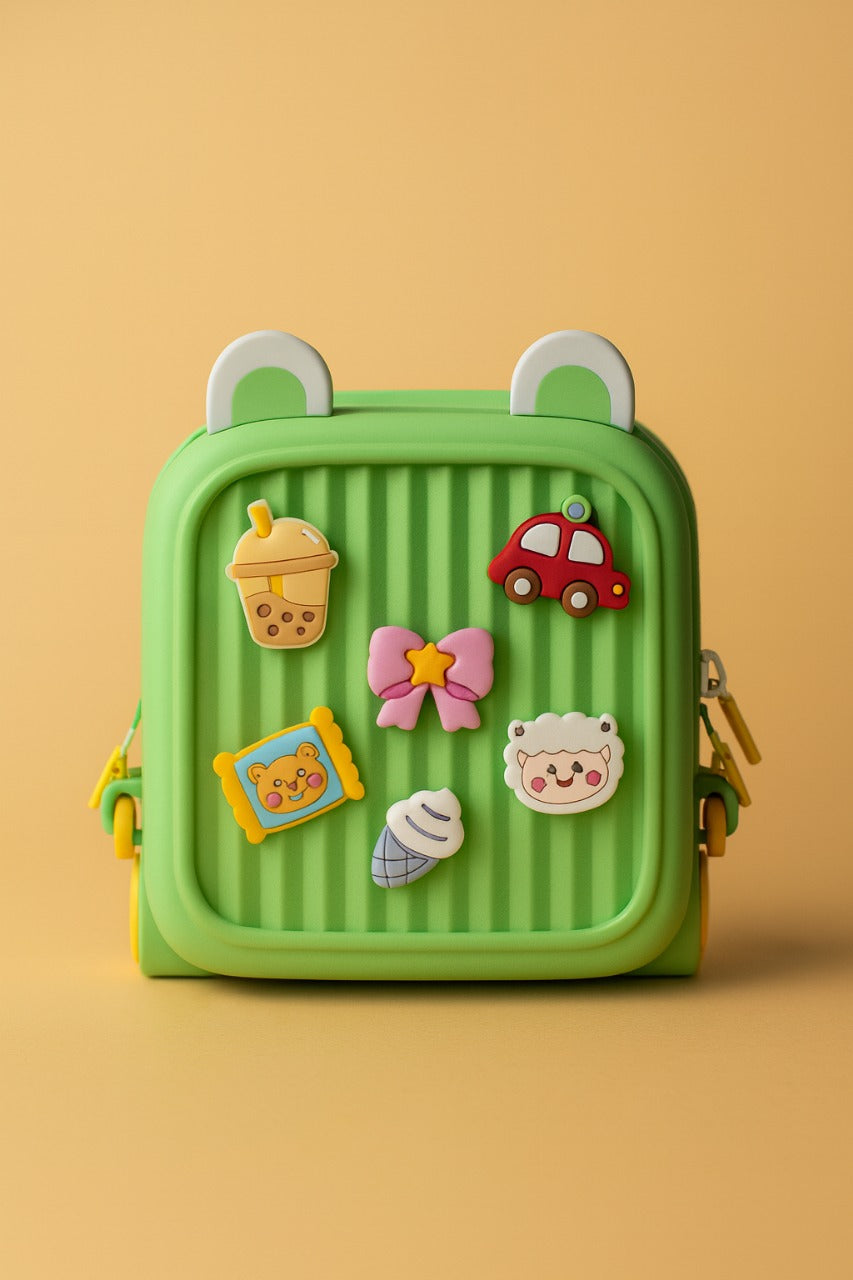 Children's backpack, bright green with character and vehicle patches on front