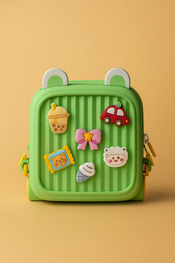 Children's backpack, bright green with character and vehicle patches on front