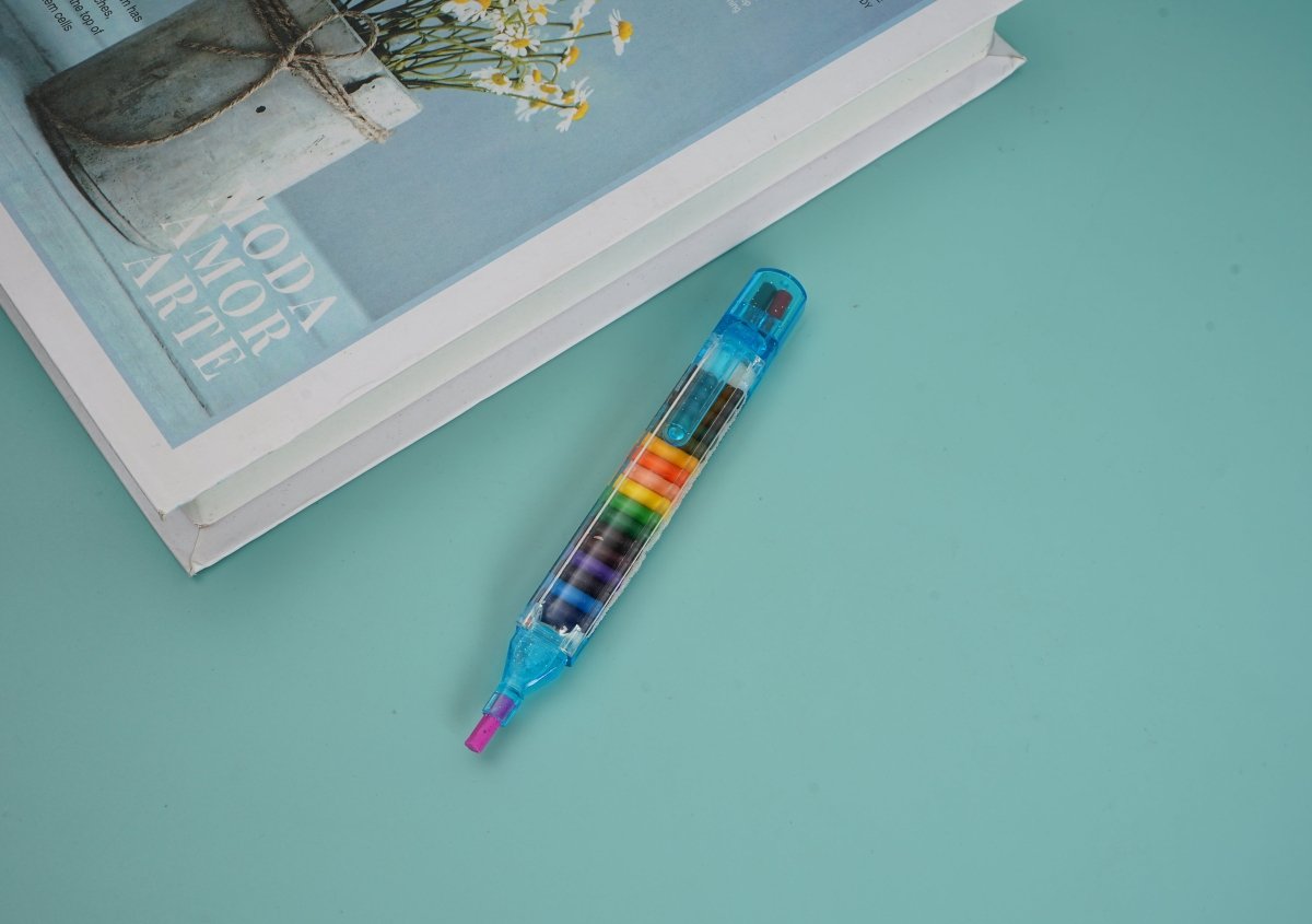 Multi-crayon pen with clear blue body and colored crayon tips