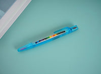 Blue retractable-style multi-crayon pen with rainbow tip section