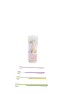 Soft toothbrushes set with four pastel handles and one extra brush, side view