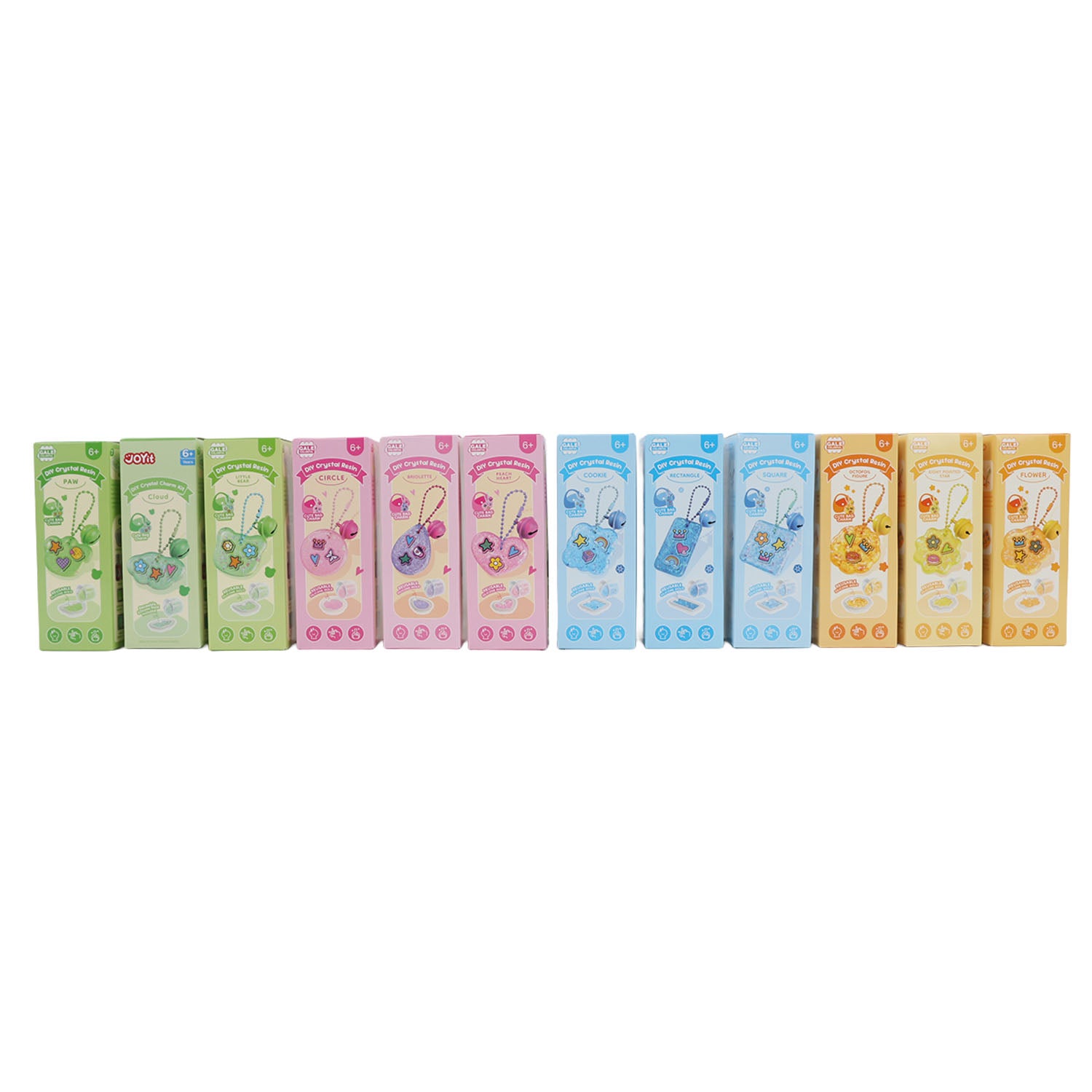 Assorted-color DIY crystal resin charm kit boxes lined up, with pendant chain designs