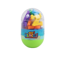 Small egg block set with purple, green, orange and yellow pieces in a clear egg shell