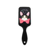 Black cat-themed square hair brush with pink bow; pin-studded pad and long handle