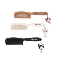 Cat flat comb set in black, off-white, and brown, each with charm