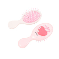 Set of light pink oval cushion hair brushes with heart graphics and pink bristles