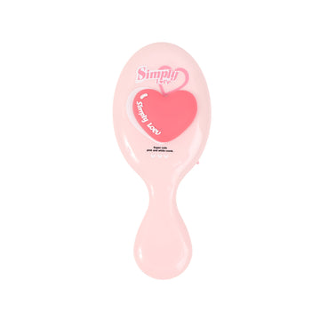 Light pink oval cushion hair brush with heart graphic and smooth paddle handle