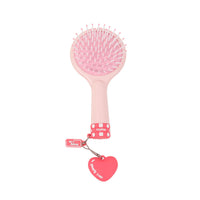 Light pink round hair brush with cushion base, pink bristles, heart charm