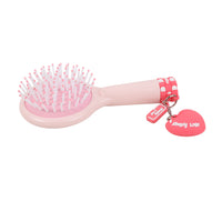 Light pink paddle hair brush with pink bristles, red check strap and heart tag