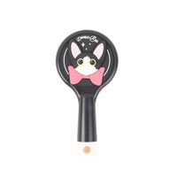 Black round cat cushion brush with Devon Rex face graphic on head