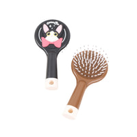 Black round cat cushion brush plus brown brush with bristles and pink bow graphics