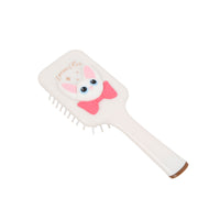 Off-white square cushion comb with cute cat face graphic and white pin teeth