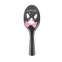 Black oval cushion hair brush with cartoon cat face on handle