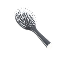 Black oval cushion hair brush with pin bristles on oval cushion head