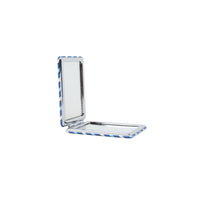 Double-sided compact mirror with side hinge open, showing rectangular reflective surface