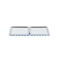 Double-sided compact mirror open with two reflective surfaces in blue pattern trim
