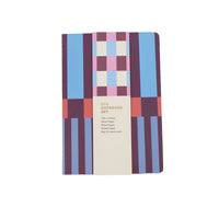 Three-piece notebook set with blue and patchwork checkerboard cover, closed