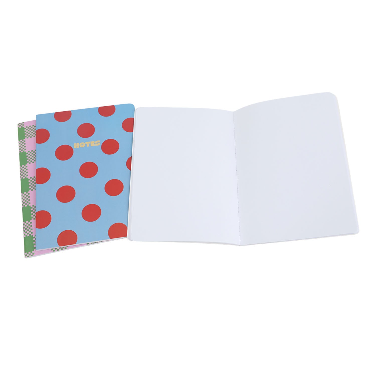 Open notebook with polka dot cover and blank pages, showing inner layout