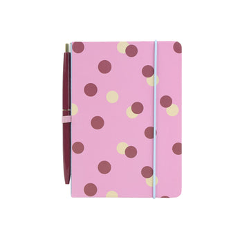 Pink polka-dot notebook with attached maroon pen, stationary kit