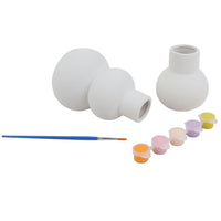 White ceramic vase painting kit with three vases, paint pots, and blue paintbrush