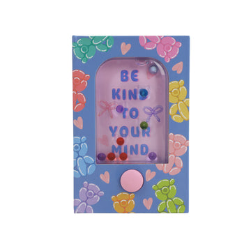 Mini hard-cover notebook front cover with heart doodles and window text: BE KIND
