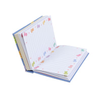 Mini hard-cover notebook open with lined pages and colorful floral borders