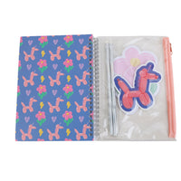 Spiral notebook set: blue floral cover open, clear pouch with sticker and pens