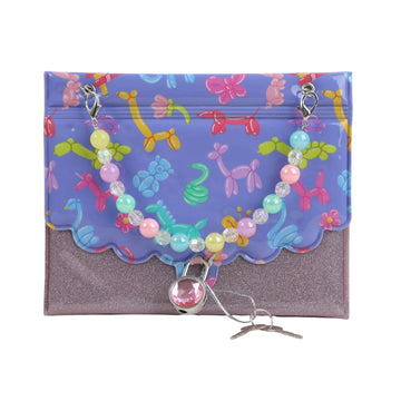 Hard-cover notebook with purple glitter base, floral bead charm and snap clasp