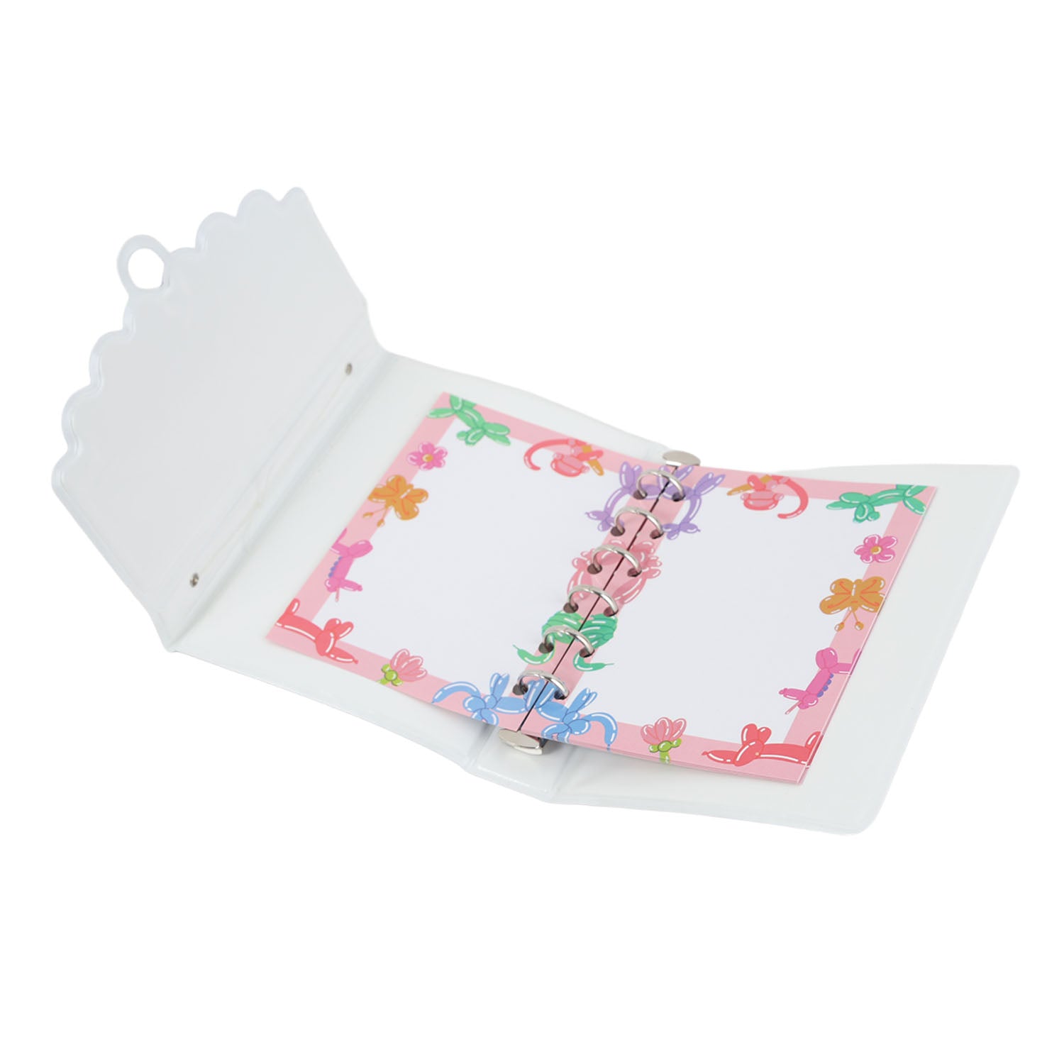 Open hard-cover notebook with pastel floral colour pages and metal rings