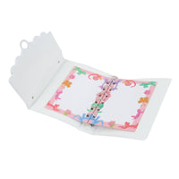 Open hard-cover notebook with pastel floral colour pages and metal rings