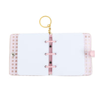 Open pink PVC notebook with white pages, 3-ring binder, transparent side display pocket