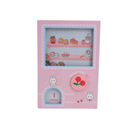 A5 hard-cover notebook with pink cover, bunnies, and colorful game graphics