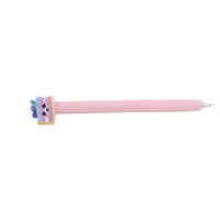 Pink ballpoint pen with pastel animal charm at the end cap