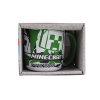 13oz ceramic mug in gift box with green handle and pixel creeper graphic
