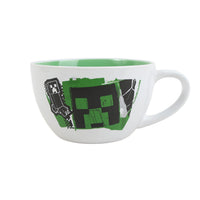 White ceramic mug with green interior and Minecraft creeper-style graphic