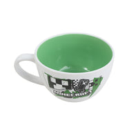 White ceramic mug with green interior and Minecraft logo on front