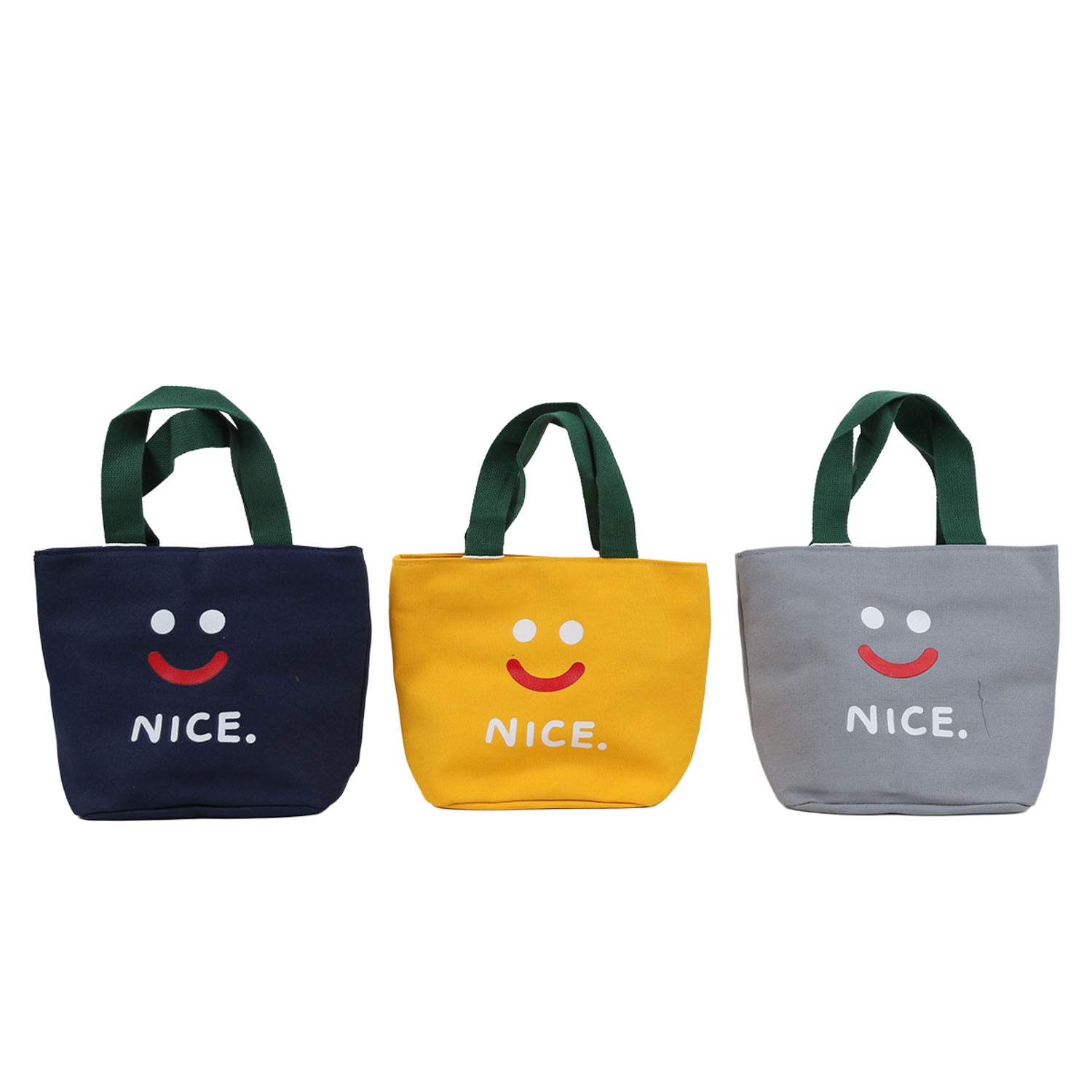 Three smiley lunch bags in navy, yellow, and gray with green handles