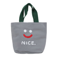 Gray handheld lunch bag with green handles, smiley face and 'NICE.' print