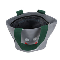 Gray lunch bag interior view with dark lining, green handles, smiley face print