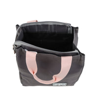 Dark gray lunch bag open at top, black interior lining, pink handle straps, zip closure.