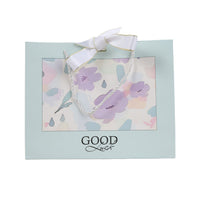 Medium gift bag with ribbon handles, light blue, floral print window