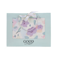 Light blue large gift bag with rope handles, floral print and 'GOOD Luck' text