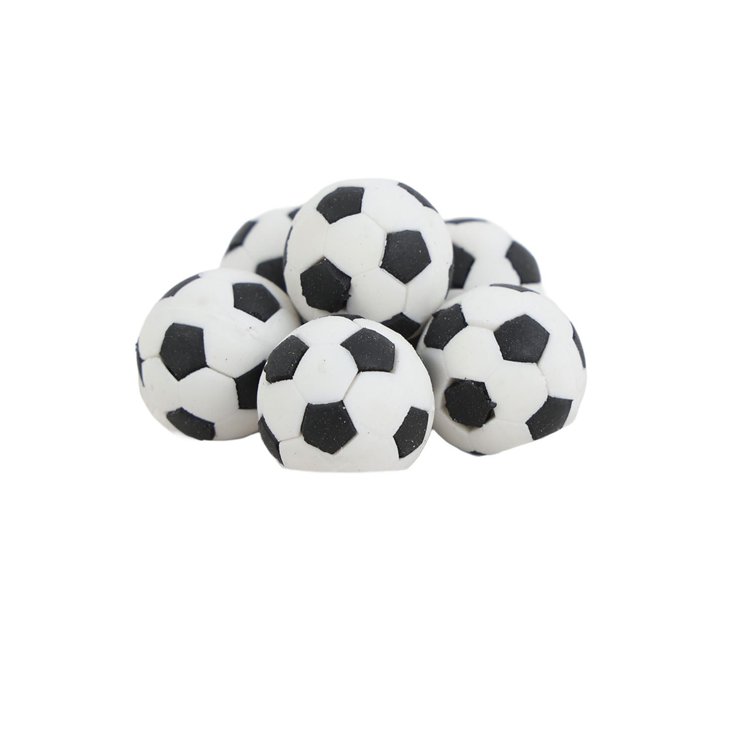 Pile of soccer ball-shaped erasers, white with black pentagon patches