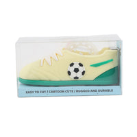 Light yellow shoe-shaped football tape dispenser with green accents and soccer ball, in box