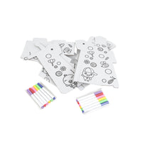 Unassembled printed cardboard pieces and colorful markers for giraffe craft