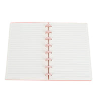 Open pink notebook with lined pages and pink spiral rings