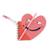Heart-shaped DIY notebook with pink pen and dangling charm on silver chain