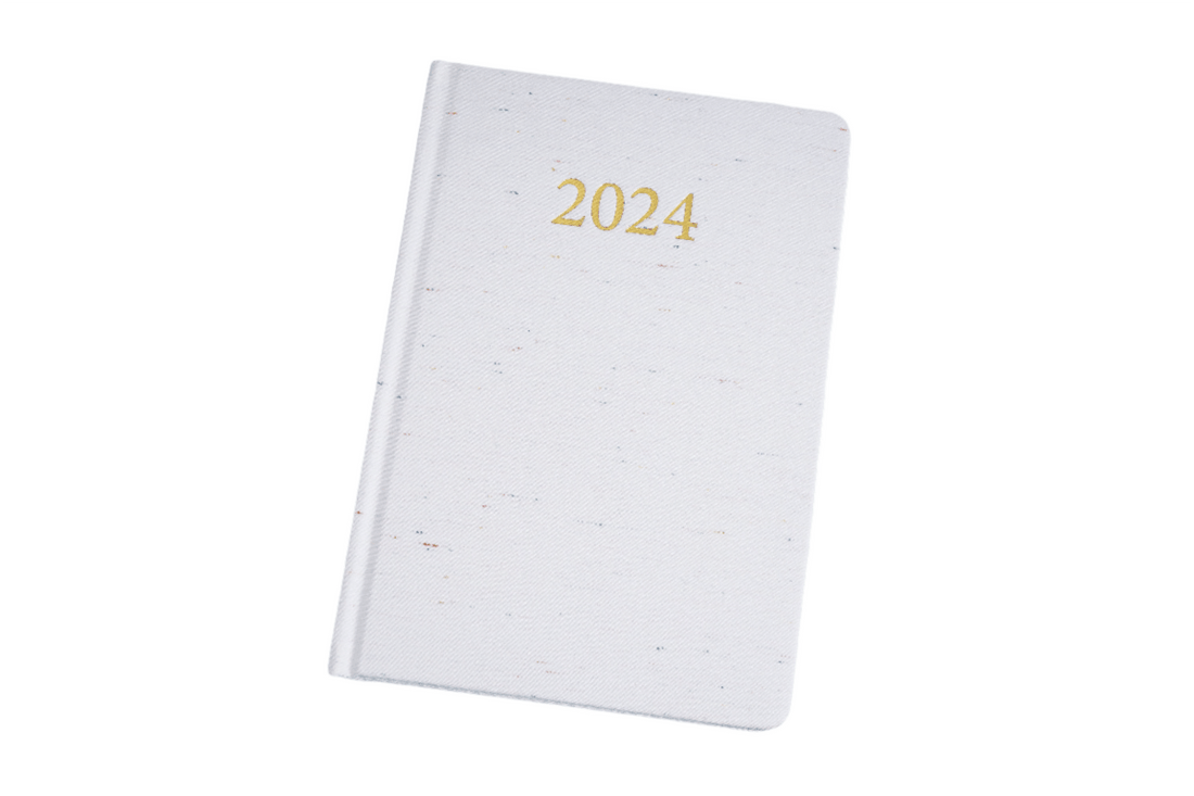 2024 daily planner, white cover with gold '2024' title